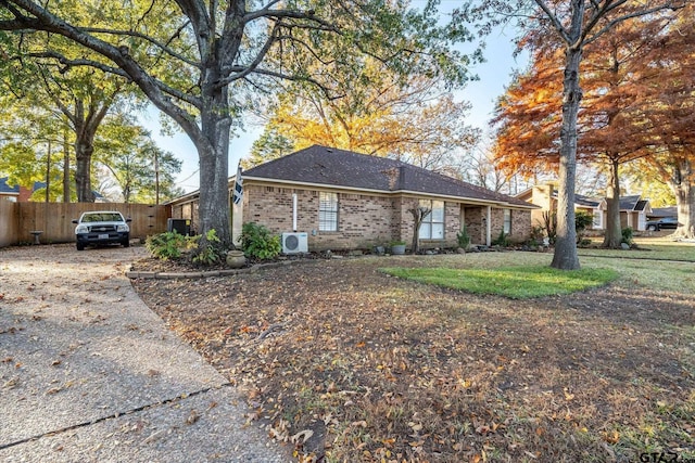 ranch-style home with ac unit