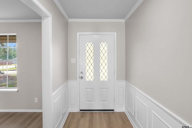 4816 Picadilly Pl, Tyler, TX 75703 - foyer with wood finished floors, a wainscoted wall, ornamental molding, and a decorative wall