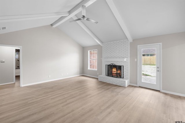 4816 Picadilly Pl, Tyler, TX 75703 - unfurnished living room featuring a brick fireplace, light wood-style floors, healthy amount of natural light, and a ceiling fan