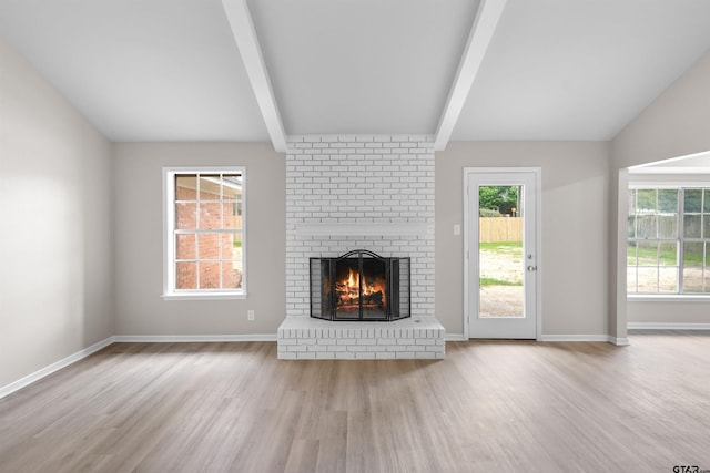 4816 Picadilly Pl, Tyler, TX 75703 - unfurnished living room with wood finished floors, a fireplace, plenty of natural light, and baseboards