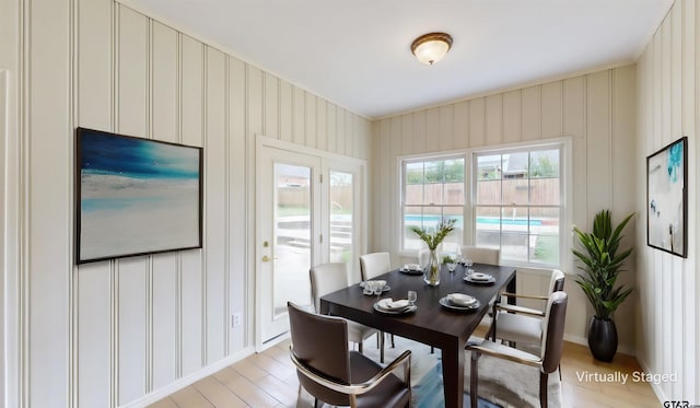 dining space with light hardwood / wood-style flooring