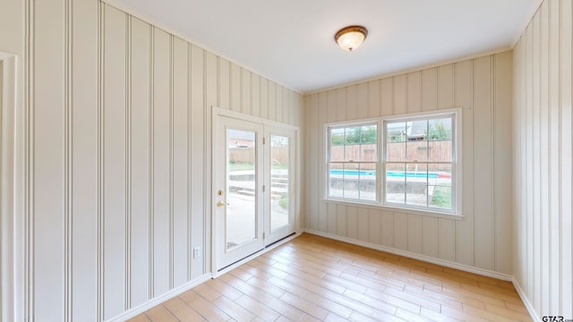 spare room with light hardwood / wood-style flooring