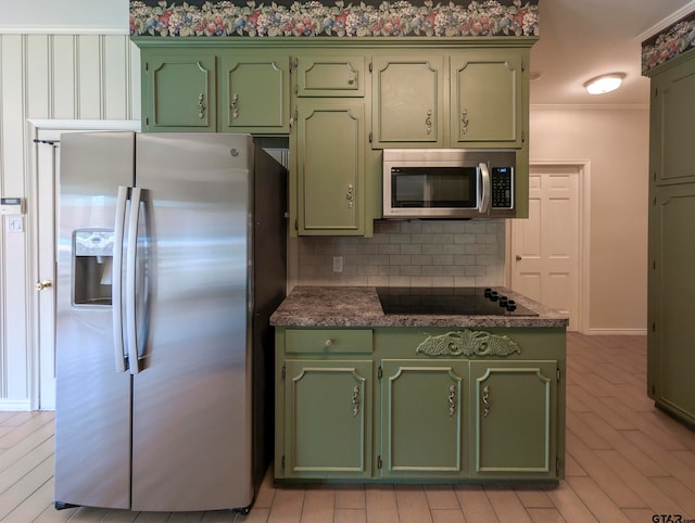 kitchen featuring appliances with stainless steel finishes, crown molding, backsplash, and light hardwood / wood-style flooring