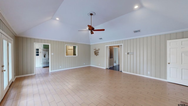 spare room with ceiling fan, crown molding, light hardwood / wood-style flooring, and lofted ceiling