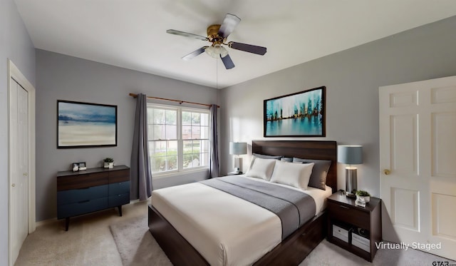 carpeted bedroom with ceiling fan