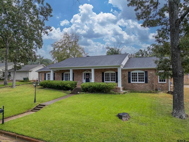 single story home featuring a front yard