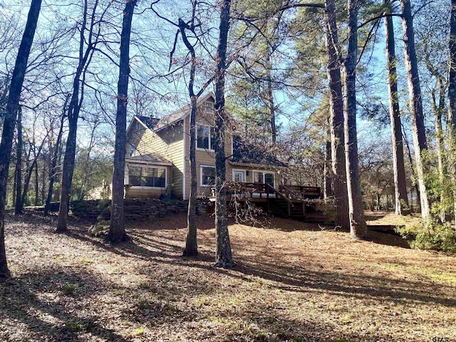 view of front of home featuring a wooden deck