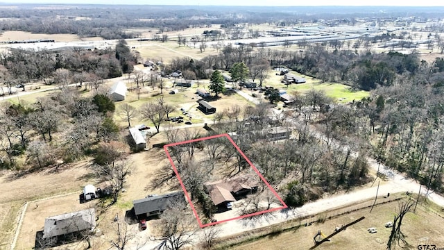 birds eye view of property featuring a rural view