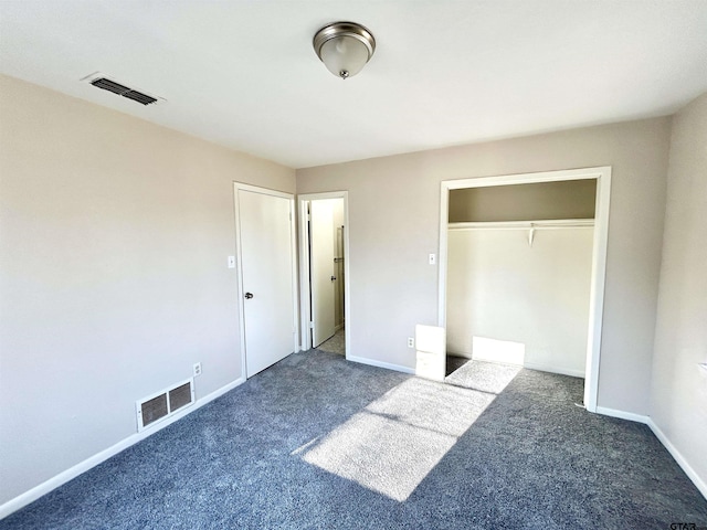 unfurnished bedroom featuring carpet floors, baseboards, visible vents, and a closet