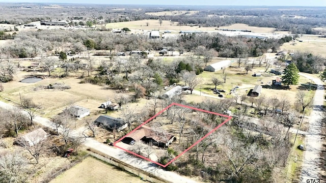 birds eye view of property featuring a rural view