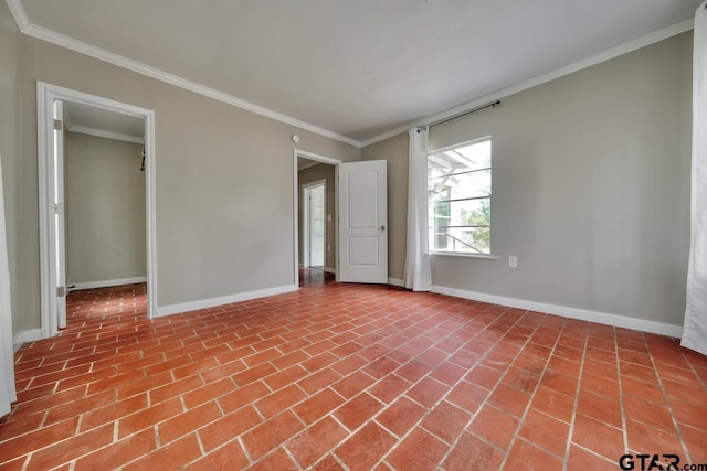 unfurnished room featuring crown molding