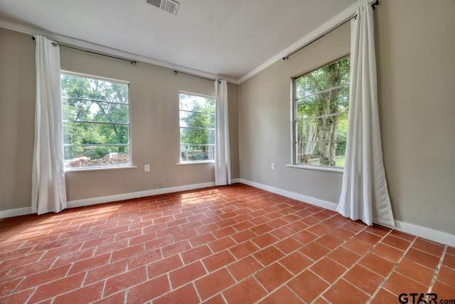 unfurnished room featuring crown molding