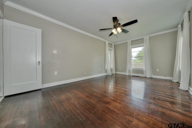 empty room with dark hardwood / wood-style floors, ceiling fan, and crown molding