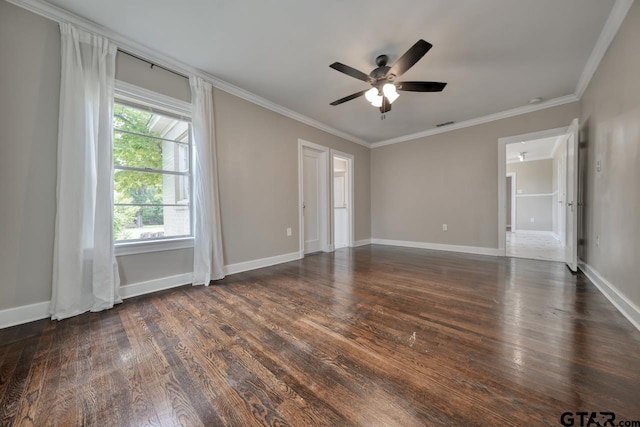 spare room with ceiling fan, dark hardwood / wood-style floors, and crown molding