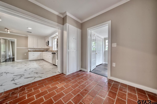 kitchen featuring crown molding, white cabinets, and stainless steel dishwasher