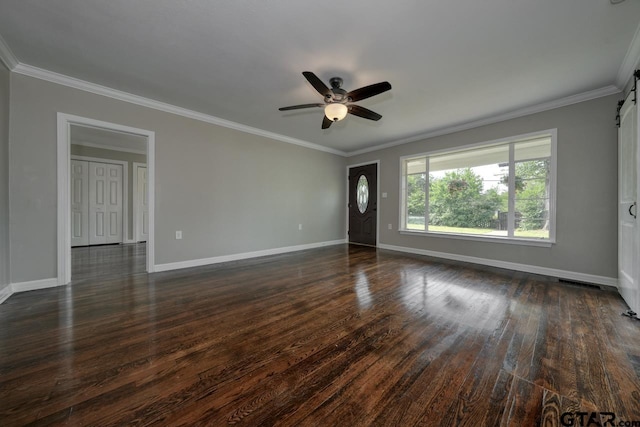 empty room featuring ceiling fan, dark hardwood / wood-style flooring, and ornamental molding