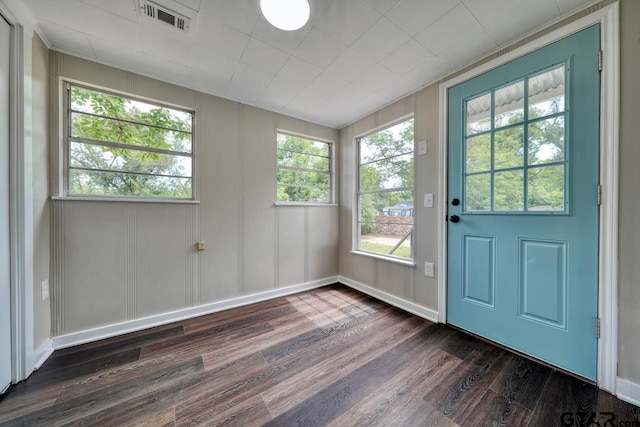 doorway with dark wood-type flooring