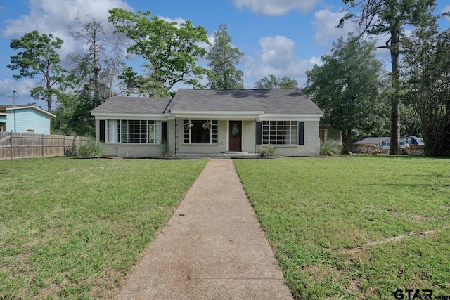 view of front of property with a front lawn