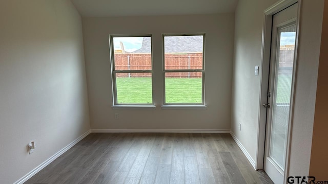 unfurnished room featuring dark wood-type flooring