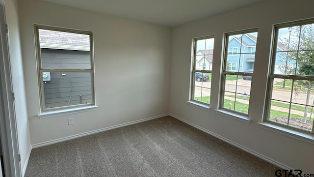 empty room with carpet flooring