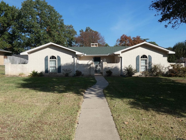 ranch-style house with a front lawn