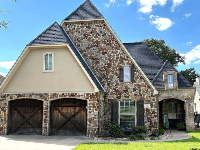 tudor-style house with a garage