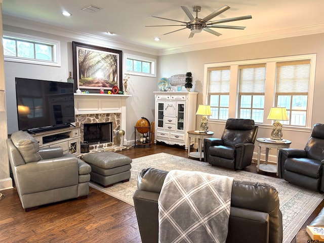 living room featuring a healthy amount of sunlight, ornamental molding, hardwood / wood-style flooring, and ceiling fan