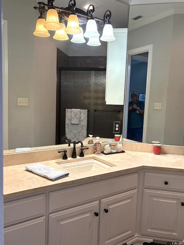 bathroom featuring vanity and ornamental molding