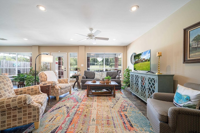 living area featuring plenty of natural light, a ceiling fan, and recessed lighting