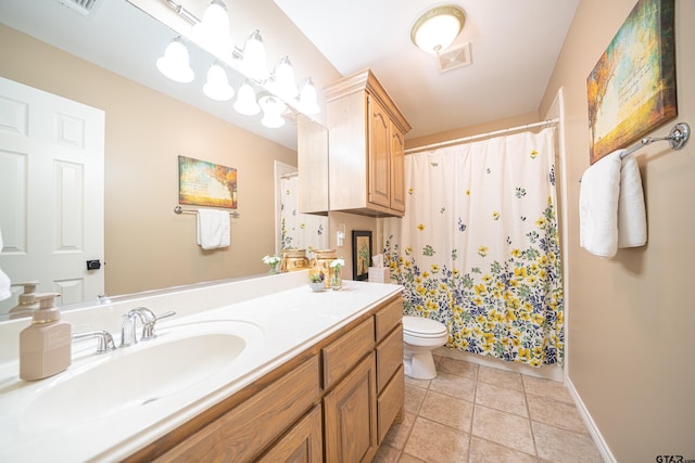 full bathroom featuring visible vents, toilet, vanity, baseboards, and tile patterned floors