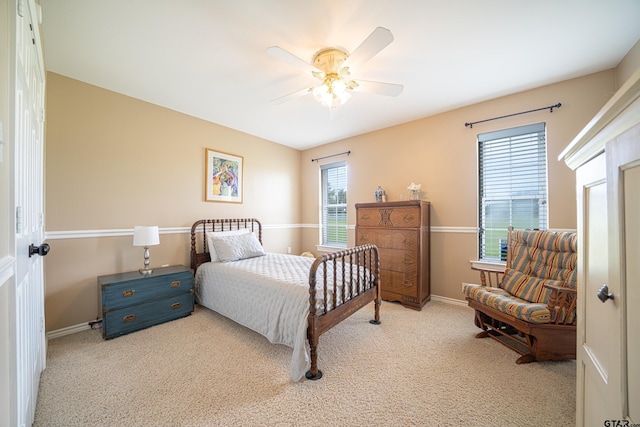 bedroom with carpet flooring, ceiling fan, and baseboards