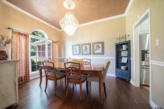 dining room featuring an ornate ceiling, dark wood finished floors, crown molding, an inviting chandelier, and baseboards