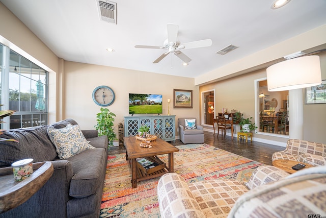 living area featuring a ceiling fan, visible vents, and recessed lighting