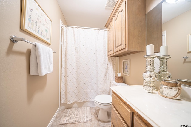 full bathroom featuring visible vents, toilet, vanity, baseboards, and tile patterned floors