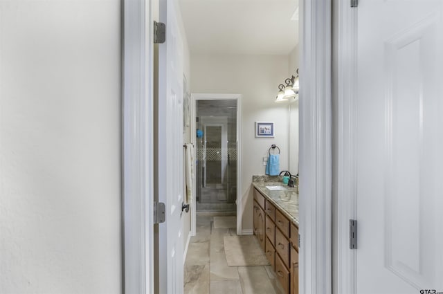 bathroom with vanity, tile patterned flooring, and walk in shower