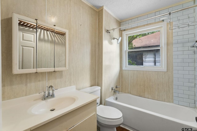 bathroom with crown molding, vanity, toilet, a textured ceiling, and bathing tub / shower combination