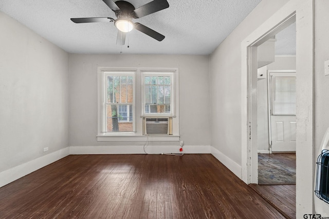 empty room featuring baseboards, a ceiling fan, hardwood / wood-style flooring, and a textured ceiling