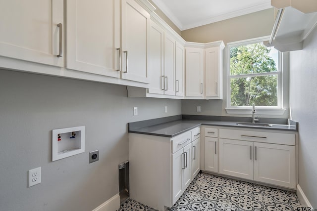 clothes washing area with ornamental molding, hookup for an electric dryer, hookup for a washing machine, cabinets, and sink