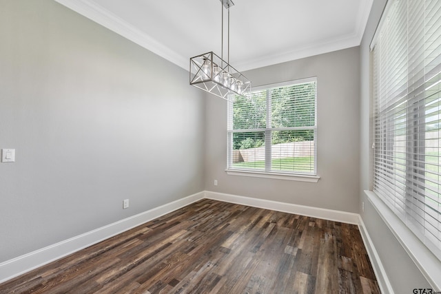 spare room with dark hardwood / wood-style floors and crown molding