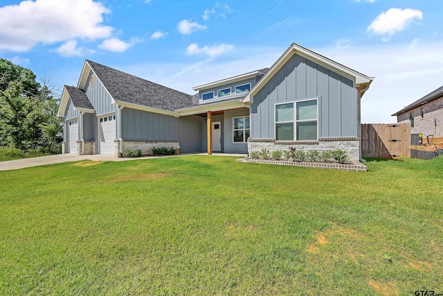 view of front of house featuring a garage and a front yard