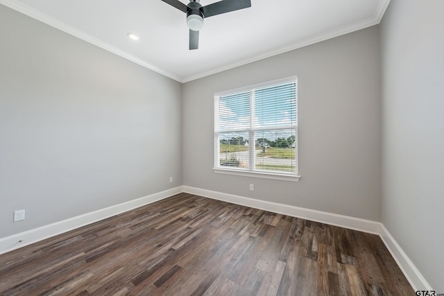 spare room featuring ceiling fan, dark hardwood / wood-style floors, and crown molding