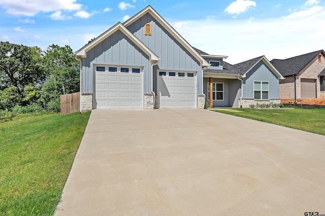 view of front of property with a garage and a front lawn