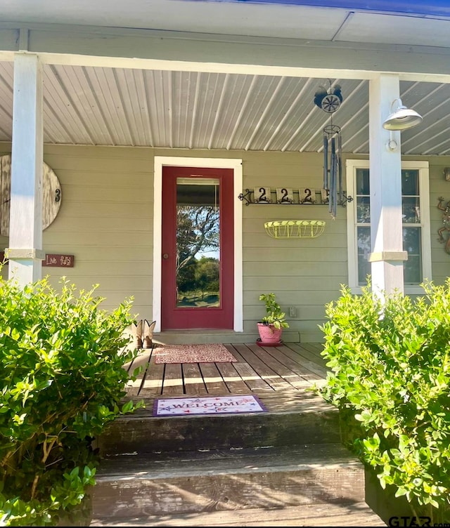 doorway to property with a porch