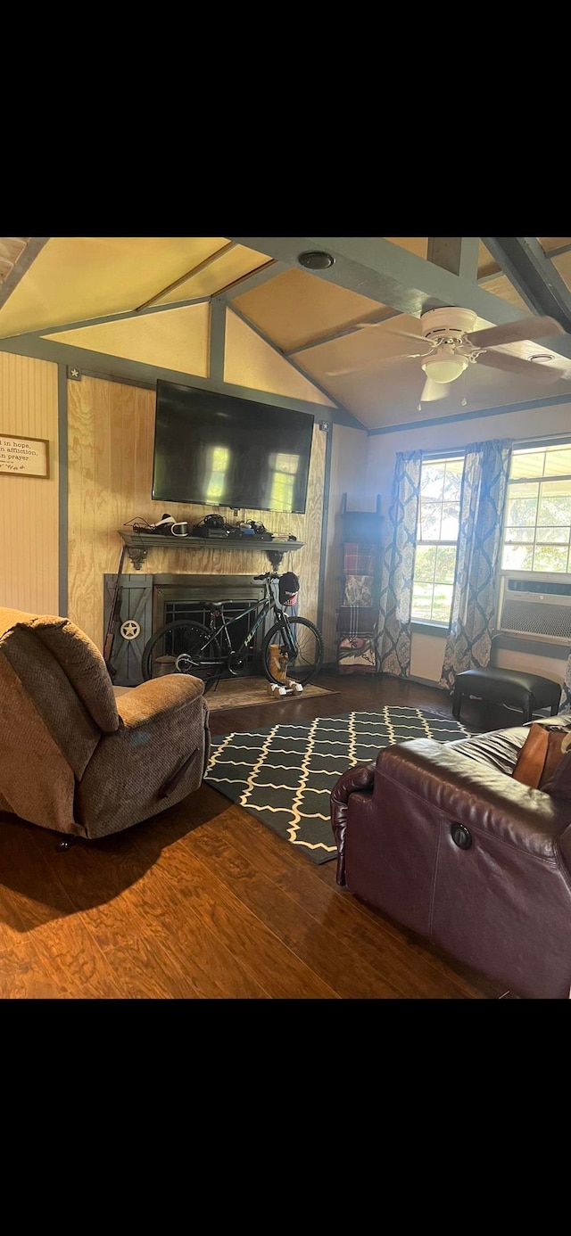 living room featuring a fireplace, ceiling fan, beam ceiling, and cooling unit