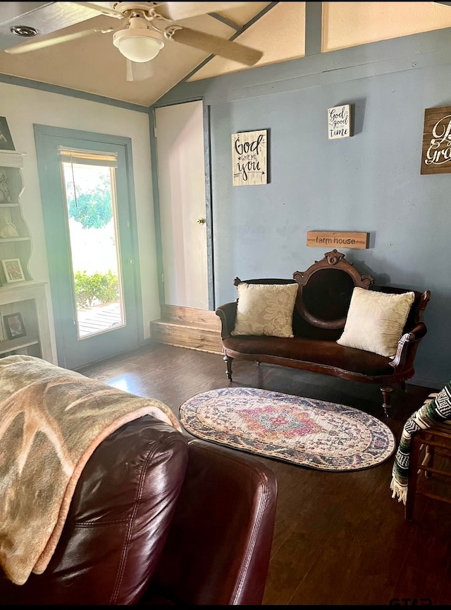 living area featuring hardwood / wood-style flooring and ceiling fan