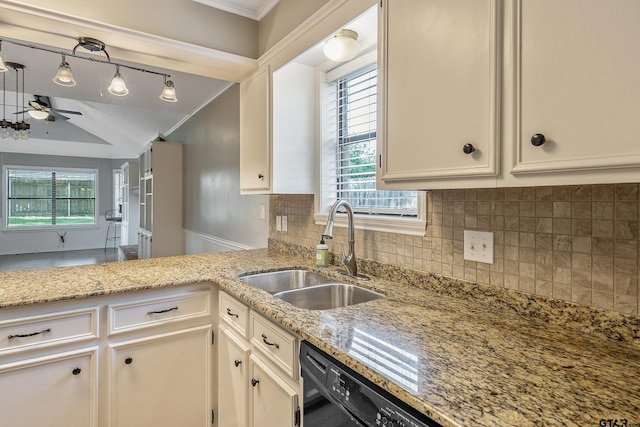 kitchen with crown molding, decorative light fixtures, decorative backsplash, sink, and kitchen peninsula