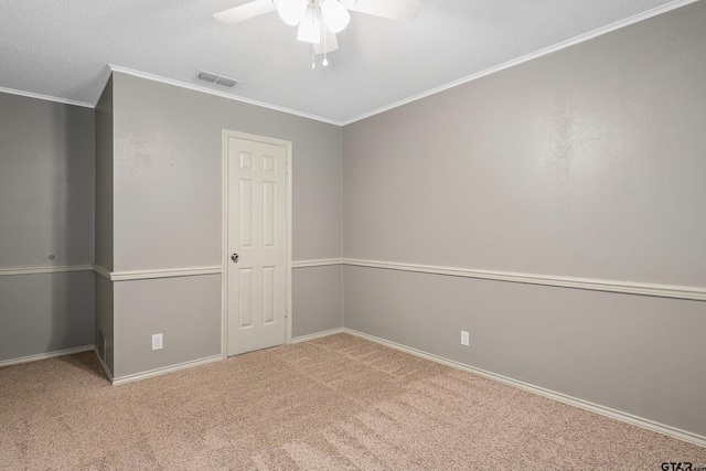 unfurnished bedroom with a closet, crown molding, carpet floors, a textured ceiling, and ceiling fan