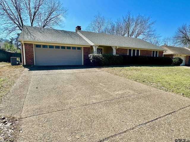 single story home with a garage, concrete driveway, and brick siding