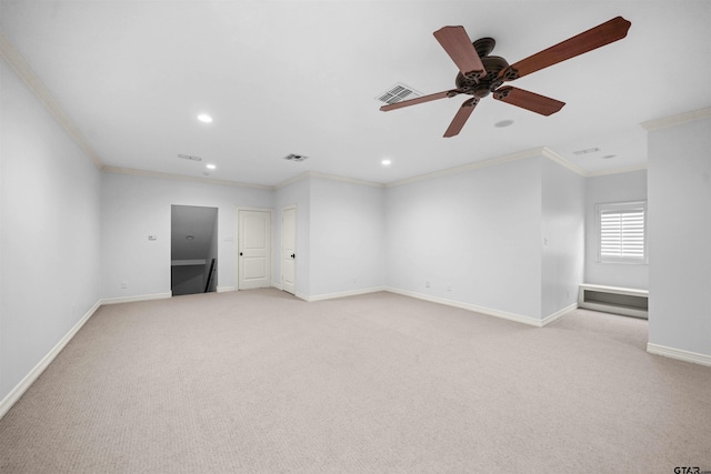 carpeted empty room featuring ceiling fan and crown molding