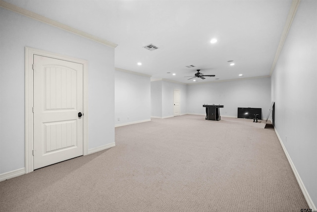 interior space with light carpet, ceiling fan, and ornamental molding